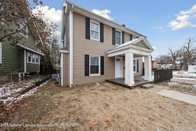 view of front of home featuring a porch and central air condition unit