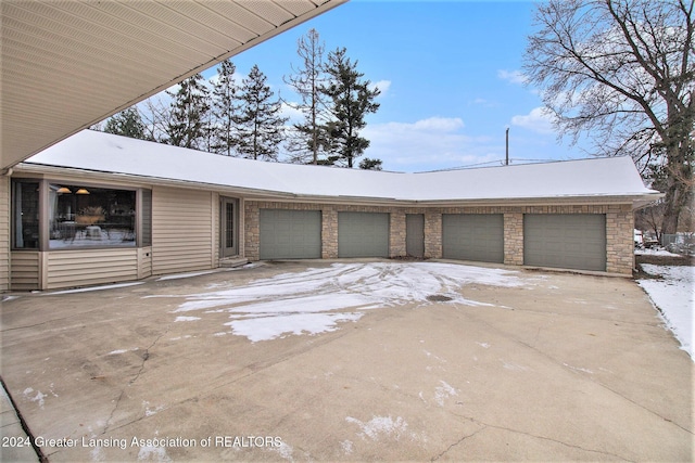 view of snow covered garage