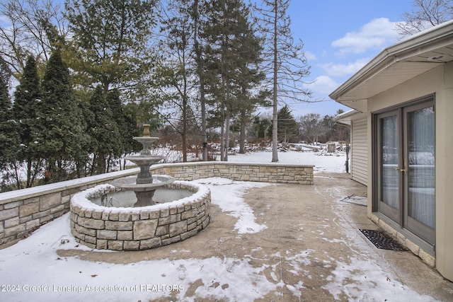 view of snow covered patio