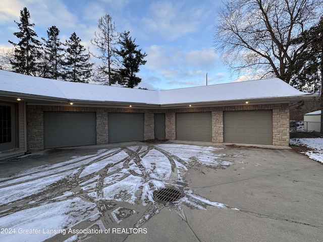 view of snow covered garage