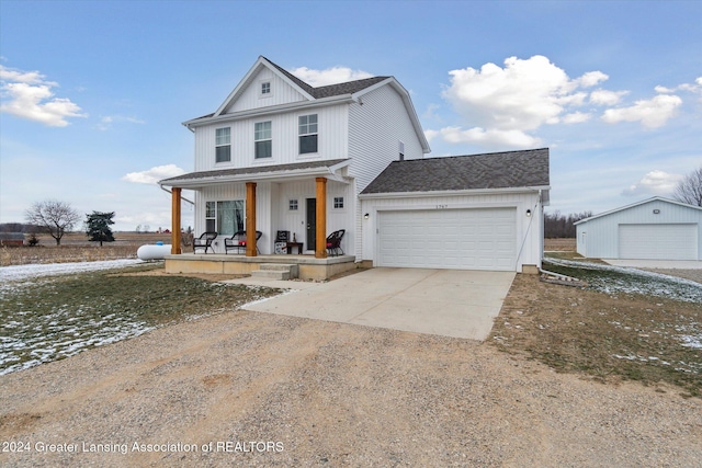 view of front of property featuring a porch and a garage