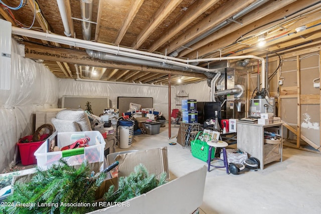 basement featuring gas water heater