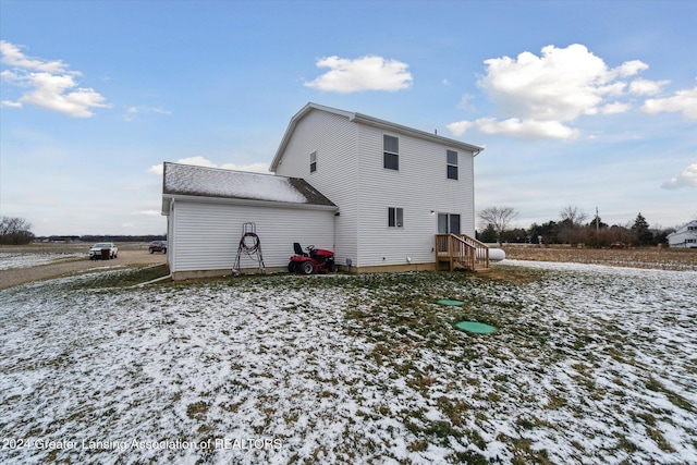 view of snow covered house