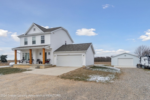 view of front of property with covered porch and a garage