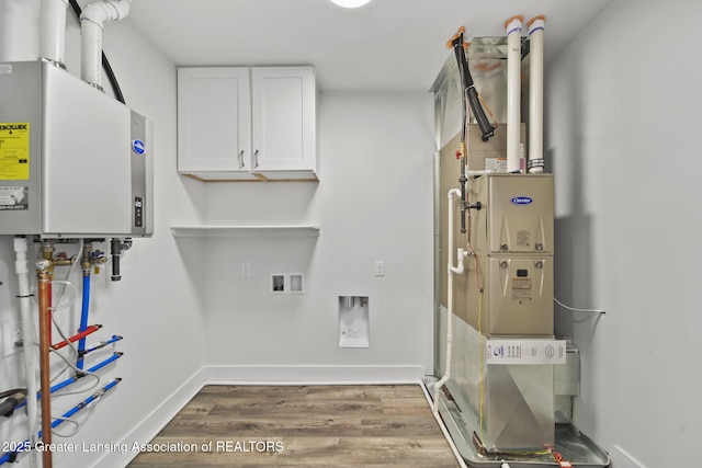 utility room featuring tankless water heater