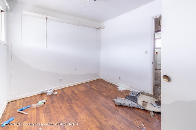 empty room with dark wood-type flooring