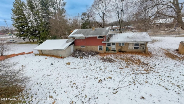 view of snow covered property