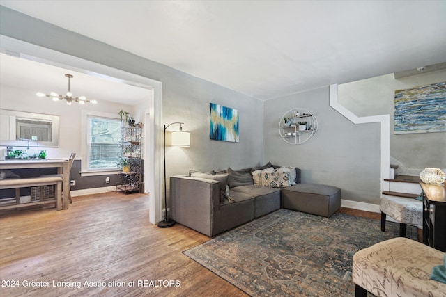 living room featuring hardwood / wood-style flooring and a chandelier