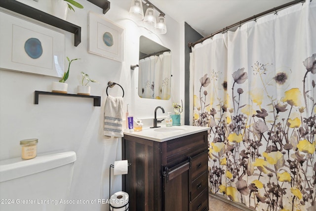 bathroom with walk in shower, vanity, and toilet