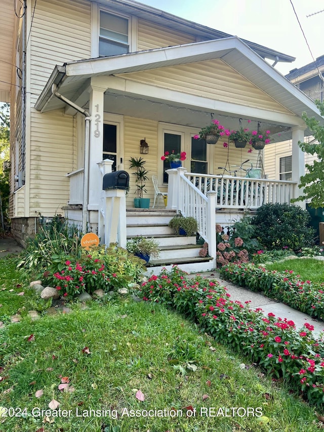 doorway to property with a porch