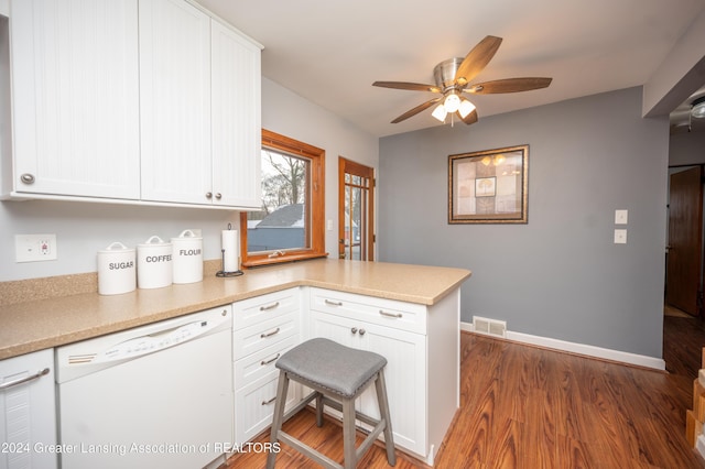 kitchen featuring white dishwasher, white cabinetry, and kitchen peninsula