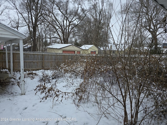 view of yard covered in snow