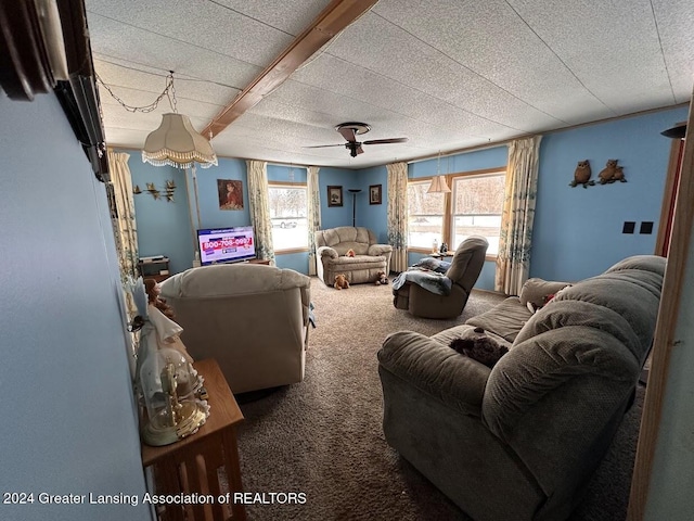 living room with carpet flooring, ceiling fan, beam ceiling, and a textured ceiling