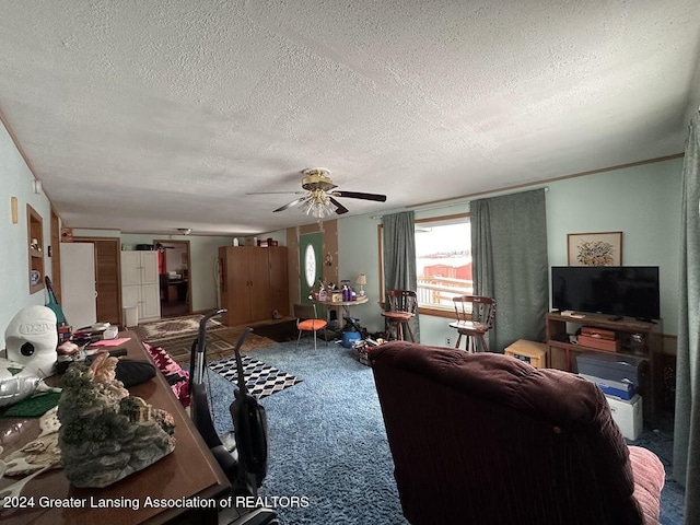 carpeted living room with ceiling fan and a textured ceiling