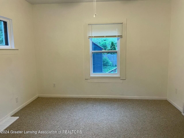 empty room featuring carpet flooring