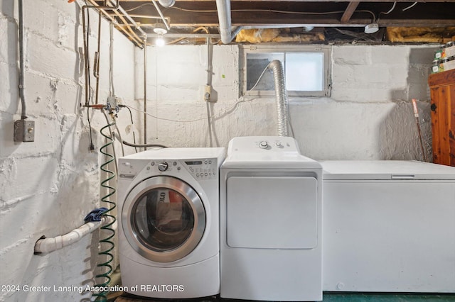 clothes washing area with washer and dryer