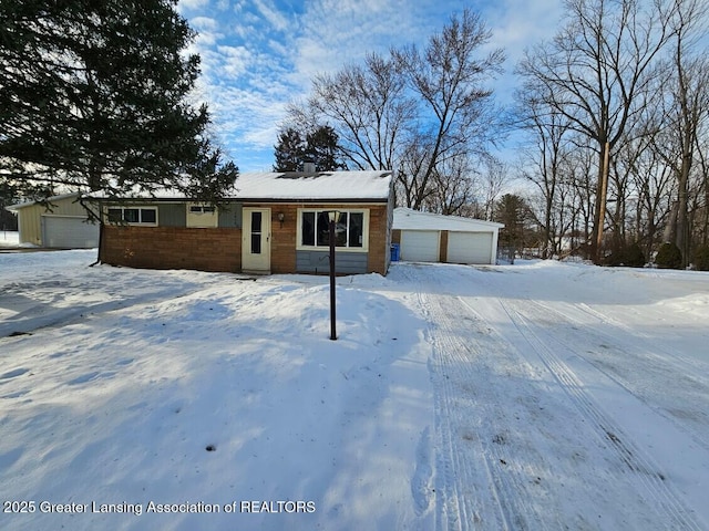 view of front facade with a detached garage