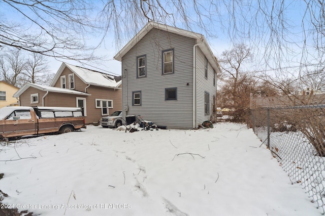 view of snow covered house