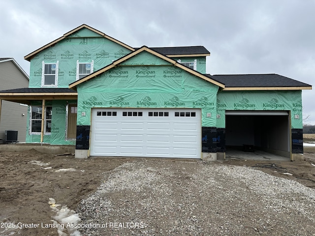 property under construction with driveway and central AC