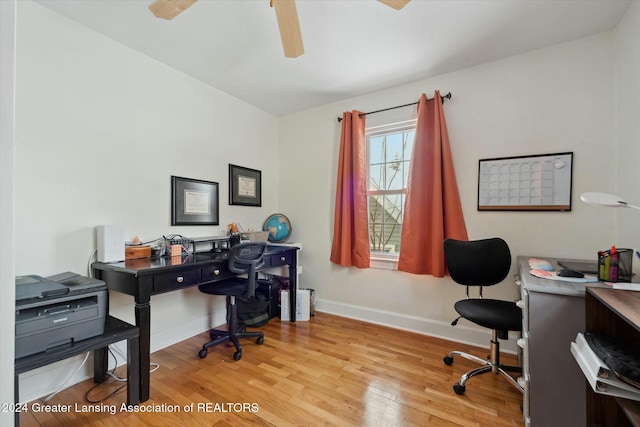 office with light hardwood / wood-style floors and ceiling fan