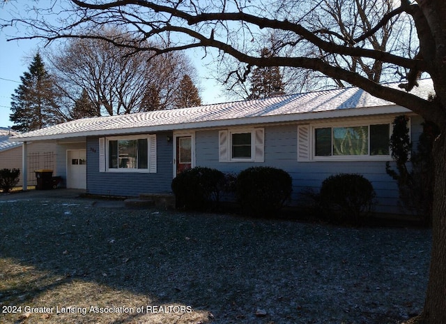 ranch-style house featuring a garage