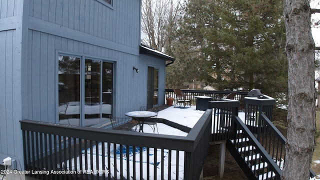 view of snow covered deck