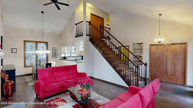 living room featuring ceiling fan with notable chandelier, dark hardwood / wood-style floors, and high vaulted ceiling