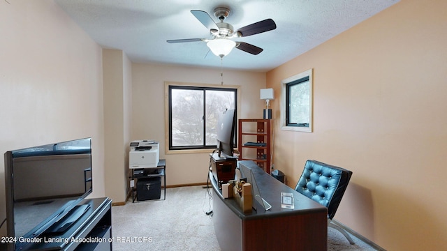 home office with light carpet and ceiling fan