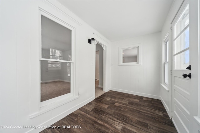 unfurnished room featuring dark hardwood / wood-style floors