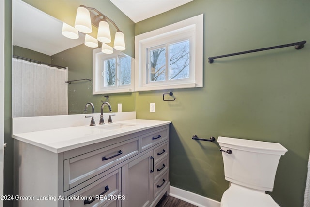 bathroom featuring vanity and toilet