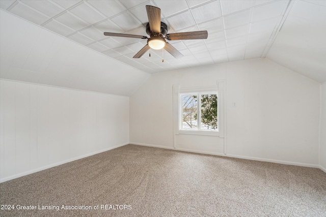 additional living space featuring vaulted ceiling, carpet floors, and ceiling fan