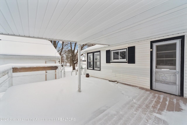 view of snow covered patio