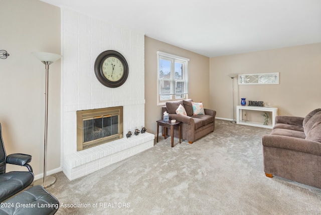 carpeted living room with a brick fireplace