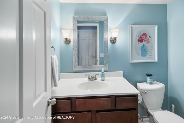 bathroom with vanity and toilet