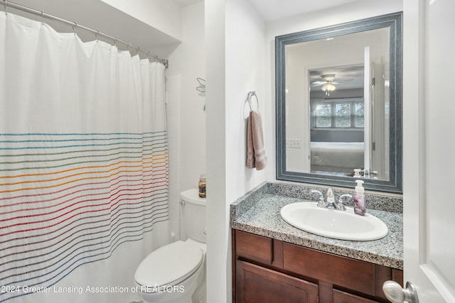 bathroom featuring a shower with curtain, vanity, ceiling fan, and toilet