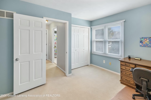 office area featuring light colored carpet