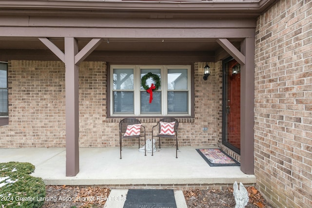 doorway to property with a porch