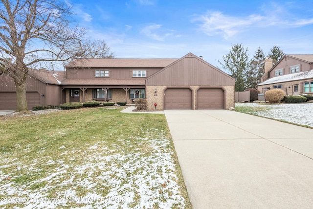 view of front of home featuring a yard and a garage