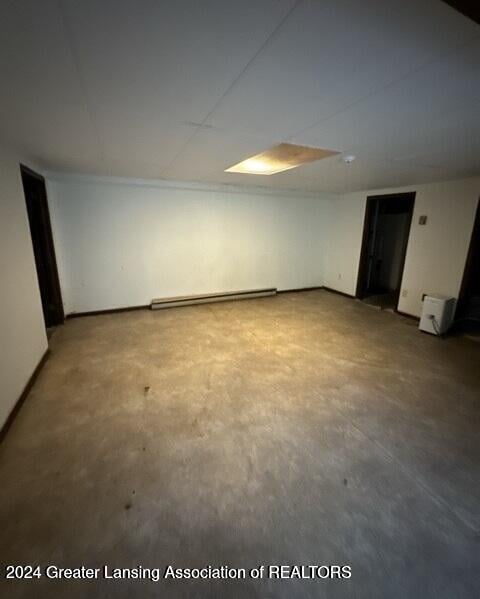 basement with a baseboard heating unit