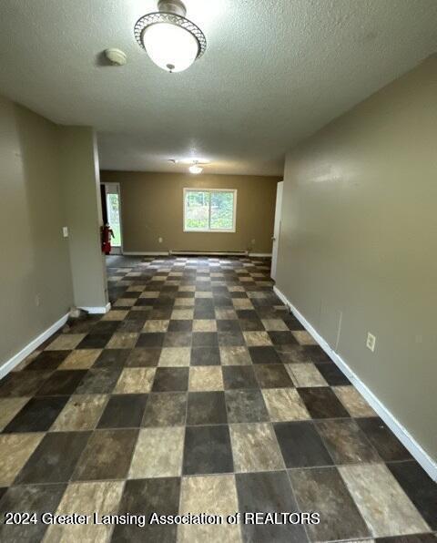 spare room featuring a textured ceiling