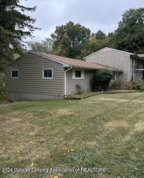 view of property exterior featuring a yard