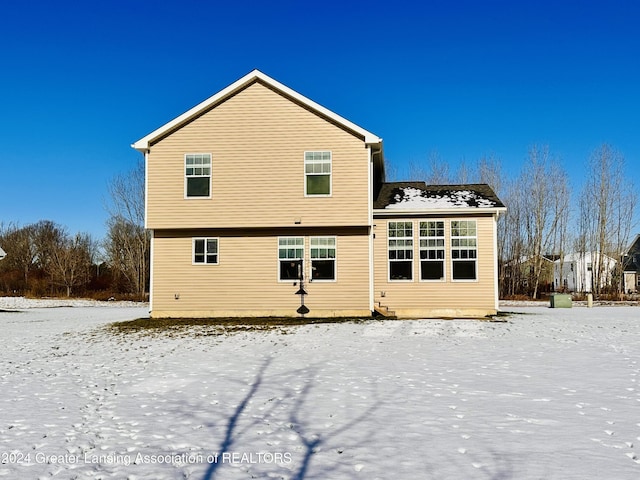 view of snow covered house