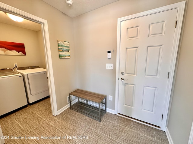 laundry area with washing machine and clothes dryer