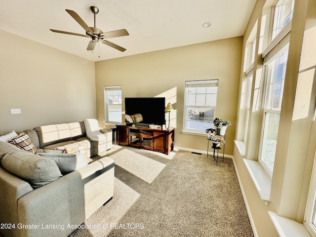 living room featuring ceiling fan and carpet flooring