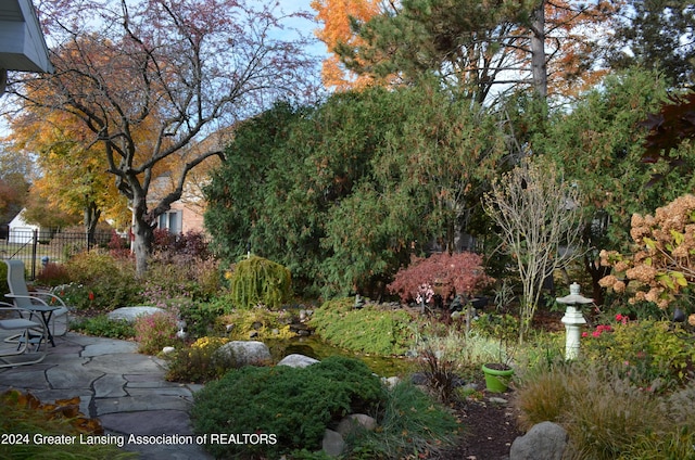 surrounding community with a patio area