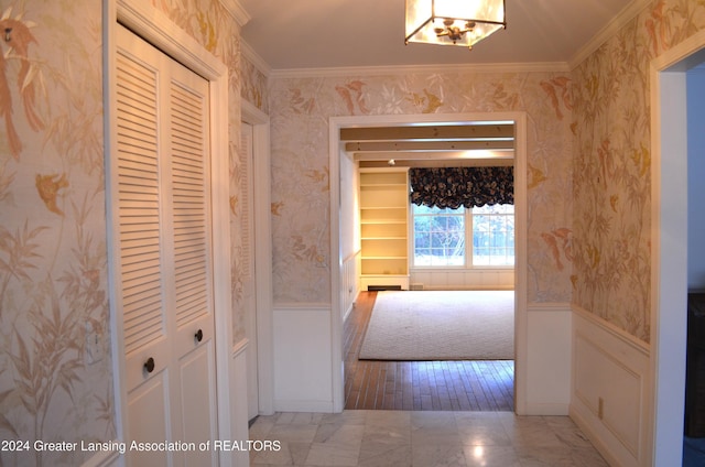 corridor featuring ornamental molding