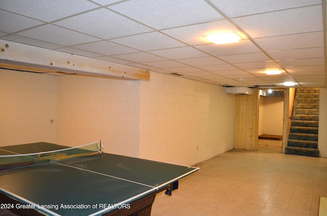 playroom featuring a paneled ceiling