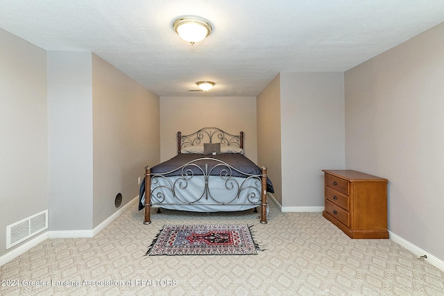 bedroom featuring a textured ceiling