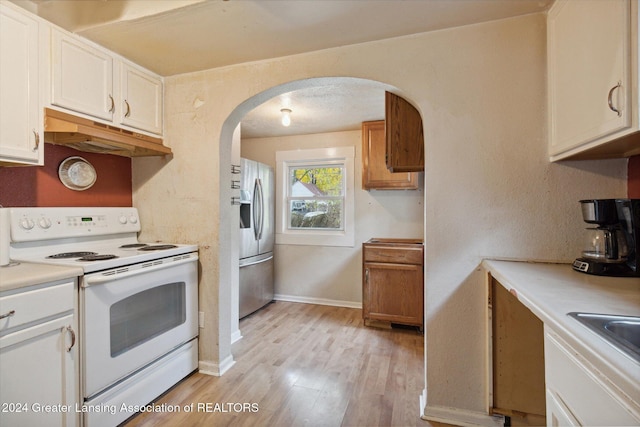 kitchen with sink, stainless steel refrigerator with ice dispenser, white range with electric cooktop, light hardwood / wood-style floors, and white cabinets