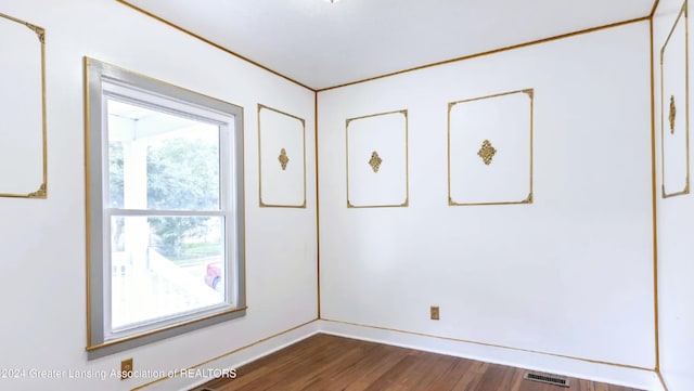 spare room with dark hardwood / wood-style flooring